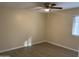 Bedroom featuring a ceiling fan, light-toned walls, and luxury vinyl plank flooring at 607 W 14Th St, Tempe, AZ 85281