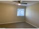 Bright bedroom features modern ceiling fan, new flooring, and neutral paint at 607 W 14Th St, Tempe, AZ 85281