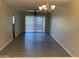 Bright dining room with modern chandelier and sliding glass doors to let in plenty of natural light at 607 W 14Th St, Tempe, AZ 85281