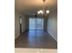 Bright dining room with modern chandelier and sliding glass doors to let in plenty of natural light at 607 W 14Th St, Tempe, AZ 85281