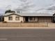 Charming single-story home features a well-maintained lawn, attached garage, and a welcoming facade at 6140 W Berkeley Rd, Phoenix, AZ 85035