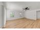 Well lit living room featuring hardwood floors, ceiling fan, and access to other rooms at 630 E Jensen St # 162, Mesa, AZ 85203