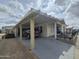 Covered carport featuring a beautiful car and golf cart at 650 N Hawes Rd # 4326, Mesa, AZ 85207