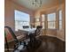 Bright dining room with natural light, a dining table set, and hardwood floors at 650 N Hawes Rd # 4326, Mesa, AZ 85207