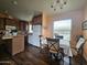 Inviting dining area with a table set for four, complemented by warm, natural light and hardwood floors at 650 N Hawes Rd # 4326, Mesa, AZ 85207