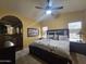 Comfortable main bedroom with ensuite bath, ceiling fan and light-filled windows at 650 N Hawes Rd # 4326, Mesa, AZ 85207