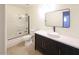 Modern bathroom featuring tub/shower combo, updated vanity and tile floors at 6847 S Willow Dr, Tempe, AZ 85283