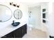 Modern bathroom featuring stylish sink, new shower, white walls, and lots of natural light at 6847 S Willow Dr, Tempe, AZ 85283