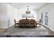 Elegant dining room with a modern chandelier and seating for eight at 6847 S Willow Dr, Tempe, AZ 85283