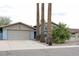 Exterior of home with a two-car garage and tall palm trees at 6847 S Willow Dr, Tempe, AZ 85283