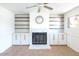 Updated living room featuring a fireplace with built-ins, white walls, and tile flooring at 6847 S Willow Dr, Tempe, AZ 85283