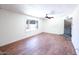 Bright living room with modern flooring, ceiling fan, and lots of natural light at 6847 S Willow Dr, Tempe, AZ 85283