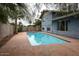 Backyard pool area with large pool and stamped concrete patio at 6847 S Willow Dr, Tempe, AZ 85283