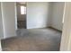 View of a spacious bedroom with plush carpet and ample natural light from the window at 7208 E Purple Prairie Dr, San Tan Valley, AZ 85143