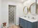 Stylish bathroom with double sinks, marble countertops, shiplap walls, and decorative tile at 7214 N Via De La Siesta --, Scottsdale, AZ 85258