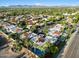 Expansive aerial view of the property's neighborhood with mountain views and lush greenery at 7309 E Rovey Ave, Scottsdale, AZ 85250