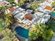 Aerial view of property featuring a backyard swimming pool, patio cover, and palm trees at 7309 E Rovey Ave, Scottsdale, AZ 85250