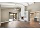 Living room with a fireplace, built-in shelving, and a view of the private pool at 7309 E Rovey Ave, Scottsdale, AZ 85250