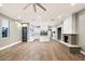 Open-concept living area showcasing a fireplace and seamless connection to the gourmet kitchen at 7309 E Rovey Ave, Scottsdale, AZ 85250