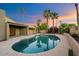 Inviting pool area with lush landscaping, privacy fence and refreshing cool blue water at 7309 E Rovey Ave, Scottsdale, AZ 85250