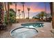 Backyard oasis features a pool, spa, and tropical landscaping at 7309 E Rovey Ave, Scottsdale, AZ 85250