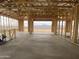 Interior framing of a new house with a mountain view in the background through the framed doors at 9548 W Parkway Dr, Tolleson, AZ 85353