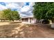 View of the backyard, featuring orange trees and patio at 9625 W Oak Ridge Dr, Sun City, AZ 85351