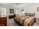 This bedroom has neutral colors, carpeted floors, and two dressers at 9625 W Oak Ridge Dr, Sun City, AZ 85351