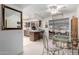 View of the dining area into the kitchen and living area at 9625 W Oak Ridge Dr, Sun City, AZ 85351