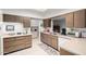 Functional kitchen with ample counter space and wood cabinetry at 9625 W Oak Ridge Dr, Sun City, AZ 85351