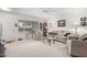 Bright living room featuring neutral tones, plush seating, and ample natural light at 9625 W Oak Ridge Dr, Sun City, AZ 85351