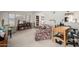 Open living space with desk, shelving, and a view into a bright adjacent room at 9625 W Oak Ridge Dr, Sun City, AZ 85351