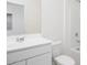 Bright bathroom featuring a clean white vanity, toilet, and a shower-tub combination at 9819 W Agora Ln, Tolleson, AZ 85353