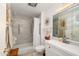 Well-lit bathroom with a shower and bathtub combo, white vanity, and stylish fixtures at 10443 W Loma Blanca Dr, Sun City, AZ 85351