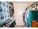 Walk-in closet with shelving and hanging rods, maximizing storage and organization at 10443 W Loma Blanca Dr, Sun City, AZ 85351