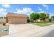 A single level home featuring an attached garage and a driveway at 10443 W Loma Blanca Dr, Sun City, AZ 85351