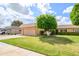 This home features a well maintained lawn, trimmed hedges and a large shade tree at 10443 W Loma Blanca Dr, Sun City, AZ 85351