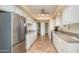 Spacious kitchen featuring stainless steel appliances, ample cabinet space, and neutral countertops at 10443 W Loma Blanca Dr, Sun City, AZ 85351
