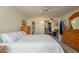 Comfortable main bedroom featuring a queen-size bed, neutral walls, and ensuite bathroom access at 10443 W Loma Blanca Dr, Sun City, AZ 85351