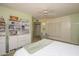 A cozy main bedroom with built-in storage, neutral color palette, and a ceiling fan at 10443 W Loma Blanca Dr, Sun City, AZ 85351