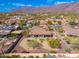 Aerial view of desert homes featuring professionally landscaped yards with mountain views at 10649 E Saddle Blanket Trl, Gold Canyon, AZ 85118