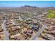 Serene aerial view showcasing mountain views, lush desert, and an upscale residential community at 10649 E Saddle Blanket Trl, Gold Canyon, AZ 85118