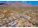 Stunning aerial view showcases this property with mountain views and desert landscaping in a beautiful, quiet community at 10649 E Saddle Blanket Trl, Gold Canyon, AZ 85118