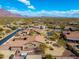 Desert community aerial view showcasing homes with beautiful desert landscaping and mountain views at 10649 E Saddle Blanket Trl, Gold Canyon, AZ 85118
