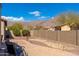 Expansive backyard showcasing desert landscaping, stunning mountain views, and a charming brick-paved patio at 10649 E Saddle Blanket Trl, Gold Canyon, AZ 85118