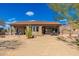 Expansive backyard showcasing a covered patio, desert plants, and a peaceful outdoor space at 10649 E Saddle Blanket Trl, Gold Canyon, AZ 85118