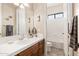 Tastefully updated bathroom features neutral paint, and a decorative mirror and sink at 10649 E Saddle Blanket Trl, Gold Canyon, AZ 85118