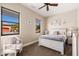 Cozy bedroom showcasing neutral paint, plush carpet, with beautiful backyard views from the windows at 10649 E Saddle Blanket Trl, Gold Canyon, AZ 85118