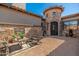 Front patio with outdoor seating, fireplace, and turret entry at 10649 E Saddle Blanket Trl, Gold Canyon, AZ 85118