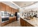 Gourmet kitchen boasts stainless steel appliances and a large granite island at 10649 E Saddle Blanket Trl, Gold Canyon, AZ 85118
